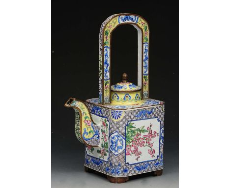 A CHINESE CANTON ENAMEL TEAPOT AND COVER, with fixed over handle, painted with panels of flowering branches on a trellis grou