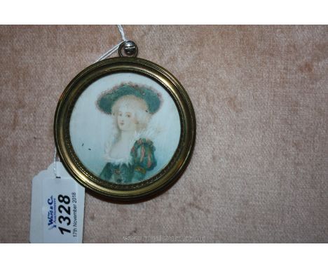 A miniature portrait of a French lady on ivory in a gilt metal frame.