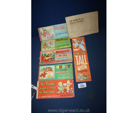 Seven Enid Blyton first edition comic strip Books and an album of 'Film Stars' cigarette card album