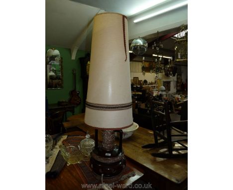 A German pottery floor-standing lamp and shade.