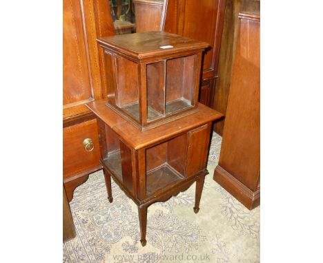 A dark satinwood/Walnut two tier freestanding Bookshelves having all round shelf recesses and standing on tapering square leg