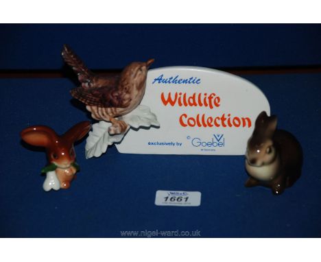 Three Goebel figures - rabbit, rabbit with a snowdrop and a plaque 'Wildlife Collection' with a wren.