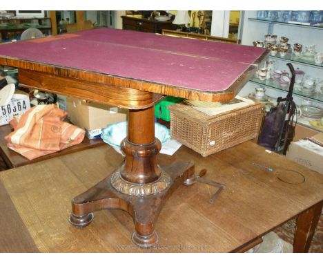 An early 19th c. Rosewood flap over Card Table, having maroon baize top, turned pillar on a platform base, 36" x 18" extendin