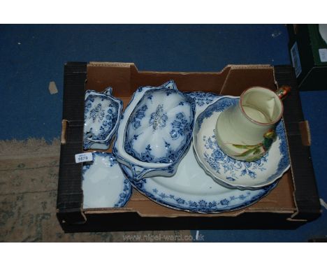 A Victorian blue and white lidded tureen, meat plate, sauce boat saucer and ladle, Clarice Cliffe parrot jug.