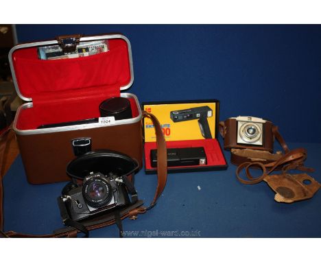 A Nikon Camera with case and accessories, Kodak Extralite 400 camera, plus another camera.