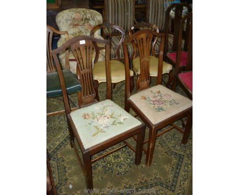 A pair of Georgian style Mahogany framed Side Chairs having floral tapestry upholstered drop-in seats and fretworked splats, 