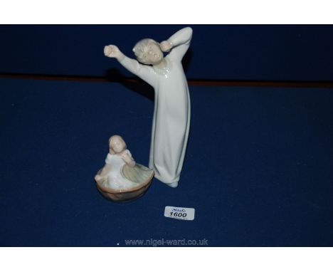 A Lladro figure of a young boy and Royal Copenhagen figure of a young girl 