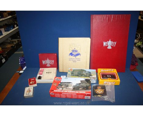 A Brownie camera, two airfix army trucks, two packs of playing cards and the game and board Wembley and a Coronation book and