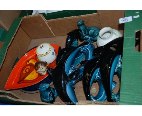A quantity of Poole pottery including Dolphins, Poole leaf shaped tray, Poole seals, etc.