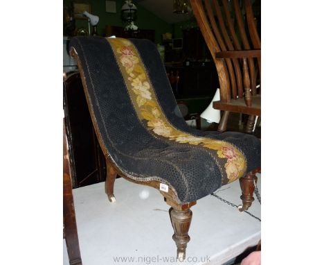 An Edwardian curved shape Nursing Chair having central tapestry floral band flanked on either side by dark fabric and standin