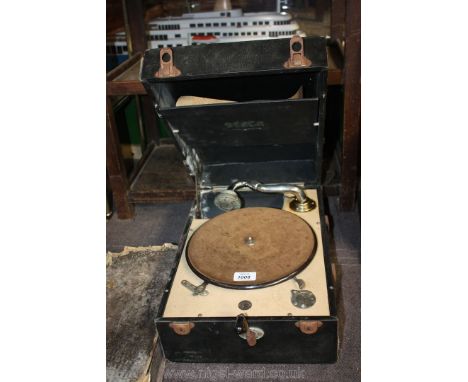 A Decca 50 Gramophone and an album of HMV 78 RPM records.