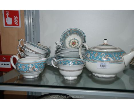 A Wedgwood 'Florentine' turquoise Tea Set including six cups, saucers and plates, teapot, sucrier and milk jug.