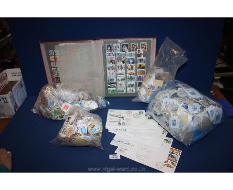 A quantity of English loose Stamps, an album of English stamps, first day covers, etc.