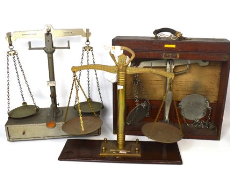 Three sets of weighing scales to include a mahogany cased set marked 'De Grabe Short & Co of London' with tambour front and c