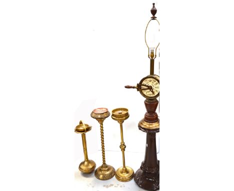 Two brass smokers stands, one with wrythen base with Arts and Crafts decoration to the top and a copper insert, and a smaller