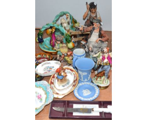 A quantity of decorative ceramics to include Capodimonte figure groups, a Hummel figure, Wedgwood Jasperware, Royal Albert et