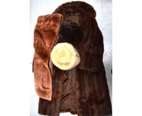 A lady's vintage musquash fur coat, two boxed fur hats to include a mink example and a vintage fur wrap (4).