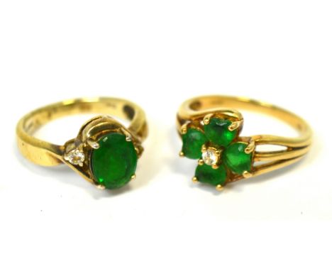 Two 9ct gold dress rings, one floral set with green stones and a central white stone, size R, and one with an oval green ston