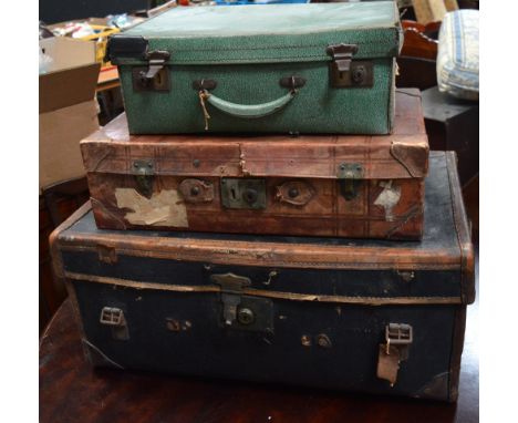 A vintage black trunk with twin leather handles, a vintage leather suitcase with blue part fitted interior and a vintage gree