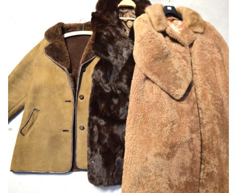 A vintage lady's musquash coat, a lady's lambs wool coat with a mink collar and a vintage gent's Richar Draper sheepskin coat