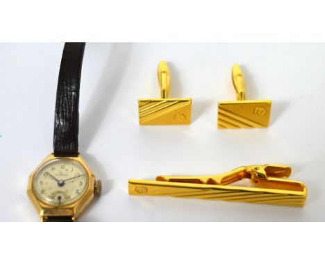 Avia; a 9ct gold lady's hexagonal wristwatch the dial set with Arabic numerals and subsidiary seconds hand on original leathe
