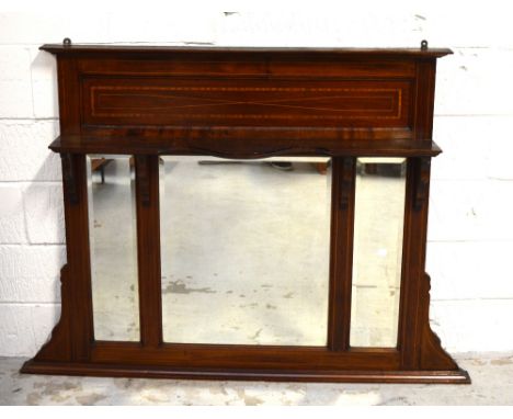 An Edwardian mahogany and satinwood cross banded overmantel mirror with three bevelled plates below shaped shelf, width 140cm