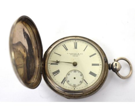 A hallmarked silver full hunter pocket watch, enamel dial set with Roman numerals and subsidiary seconds hand, and inscribed 