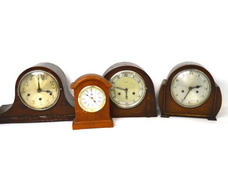 Three vintage oak cased mantel clock to include a Napoleon hat shaped example, the silvered dial set with Arabic numerals and