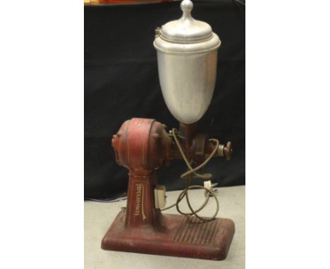 A large vintage coffee grinder.