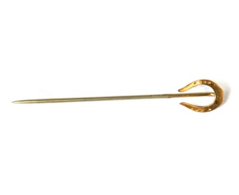 A 1930s gentlemen's 10ct gold stick pin in a horseshoe design.
