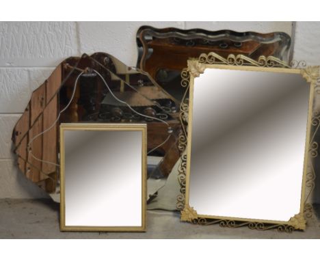 Three vintage wall mirrors all with shaped borders and a small table mirror (4).
