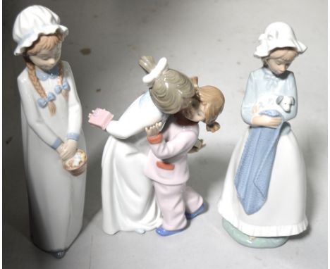 Three Nao figures, a girl with a basket, two children, one in a nightdress and one in pyjamas and a girl holding a puppy (3).