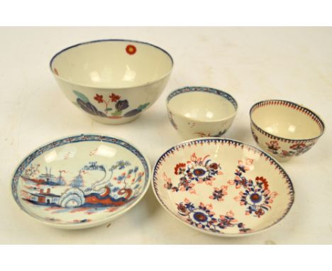 A Liverpool, Seth Pennington tea bowl and saucer, c.1785, painted in underglaze blue in the "Cannonball" pattern and clobbere