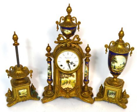 A reproduction Italian ornate gilt metal eight day mantel clock the dial set with Roman numerals and marked 'Imperial' decora