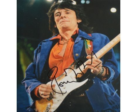 A signed photographic print of Ronnie Wood of the Rolling Stones,  image size 24 x 19cm, framed and glazed. CONDITION REPORT 