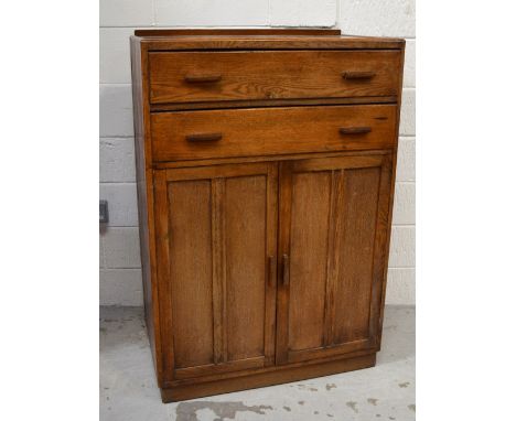 A mid 20th century oak tallboy, two long drawers over two cupboard doors with one interior shelf on plinth base, 122 x 82cm