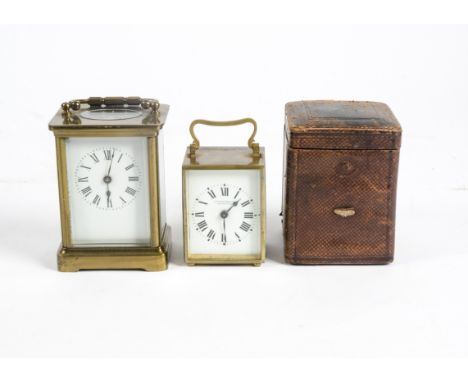 An early 20th Century French brass carriage clock by Camerer Kuss &amp; Co. London, white enamel dial with Roman numerals, in