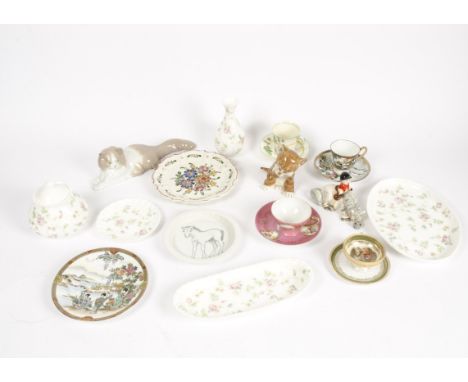 A selection of 20th Century ceramics, consisting of cups, sculptures, vases, and more, including a Nao 'cat', Beswick horse, 