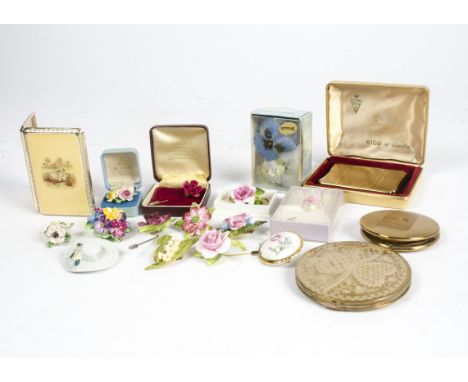 A selection of Staffordshire ceramic brooches and earrings modelled as flowers, together with four 20th Century powder compac