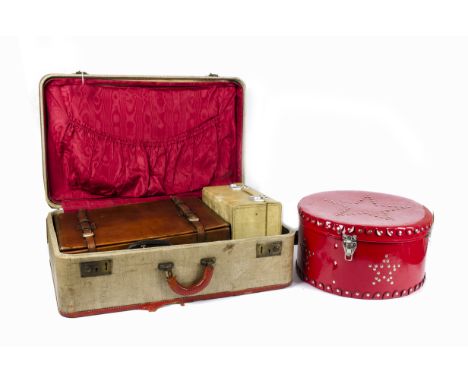 A 20th Century Windriver Hat Co. custom made hat, in a red hat box, a fabric bound travelling chest, leather suitcase, approx
