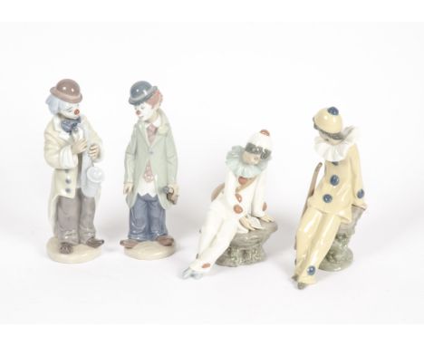 Two Lladro figures of clowns, consisting of no.5472 'Circus Sam with violin' and no.5471 'Sad Sax', together with two Nao clo