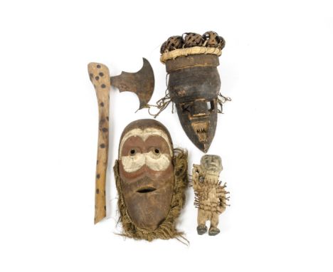 Two Salampasu masks, one with applied copper work and rattan balls to head, together with a Kngo figure and an axe with circu