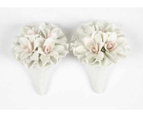 A pair of boxed Lladro bouquet groups, the delicate flowers surmounted in ceramic lace, one A/F, 10.5cm