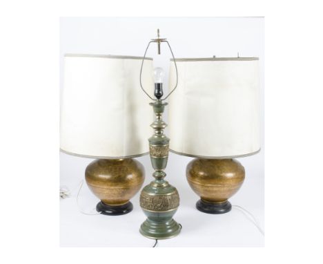 A group of four 20th Century metalwork lamp bases, one pair with a golden copper colour effect with circular loop handles to 