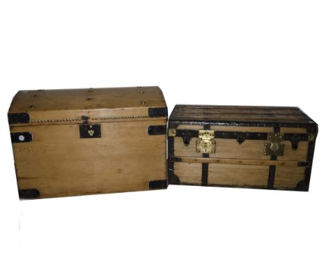 An Edwardian pine and metal mounted trunk, the dome rising top with paper label for J Milford Bath, with fitted interior and 