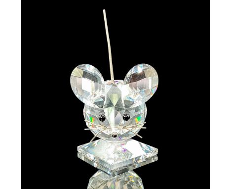 Exclusively available in the USA and Canada, this crystal mouse figurine showcases a clear body, black eyes and nose, and a d