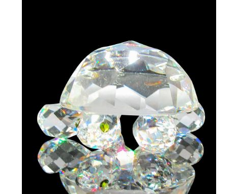 Part of the Endangered Species group. Clear faceted body with round legs and green crystal eyes. Swarovski backstamp. 7632045