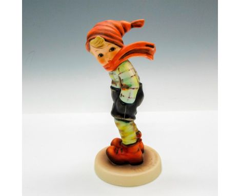 Matte finished boy figural dressed for heavy winds. Goebel backstamp. Issued: 1979 - 1990Dimensions: 2.5"L x 2.5"W x 5"HManuf