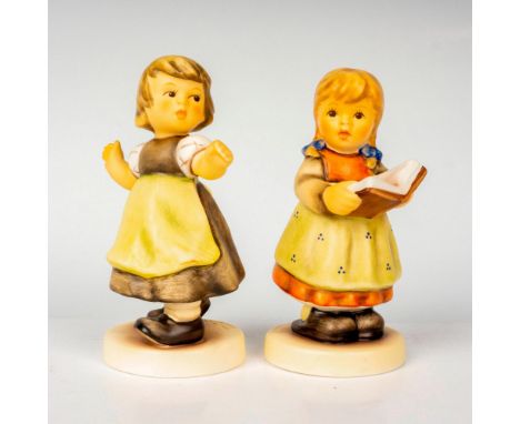 Hand painted in matte finish modeled as a girl with book in hand and young girl enjoying the breeze. M. I. Hummel impressed b