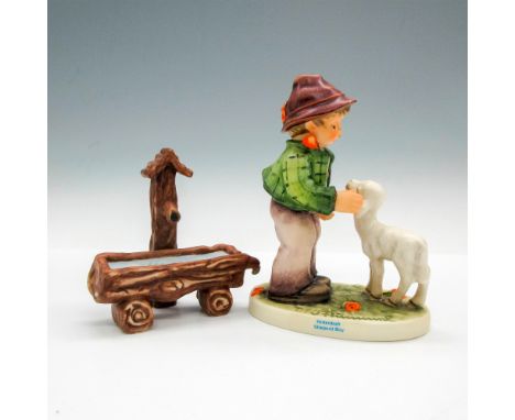 Matte porcelain, hand painted. Timid boy gently approaches a young lamb. M. I. Hummel inscribed on base. First issue 1996. Go